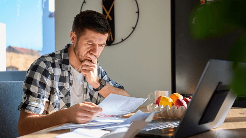 Homeowner reviewing documents about tax payments