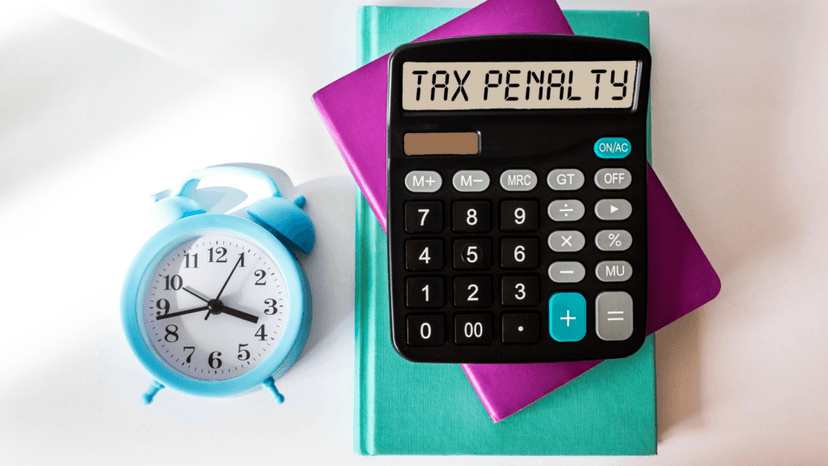 Calculator displaying tax penalty warning for late business filings