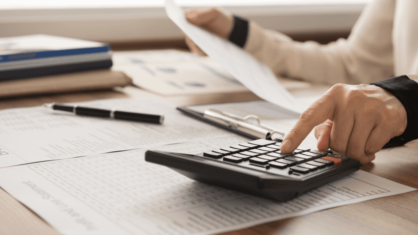 Calculating property tax bills using paperwork and a calculator