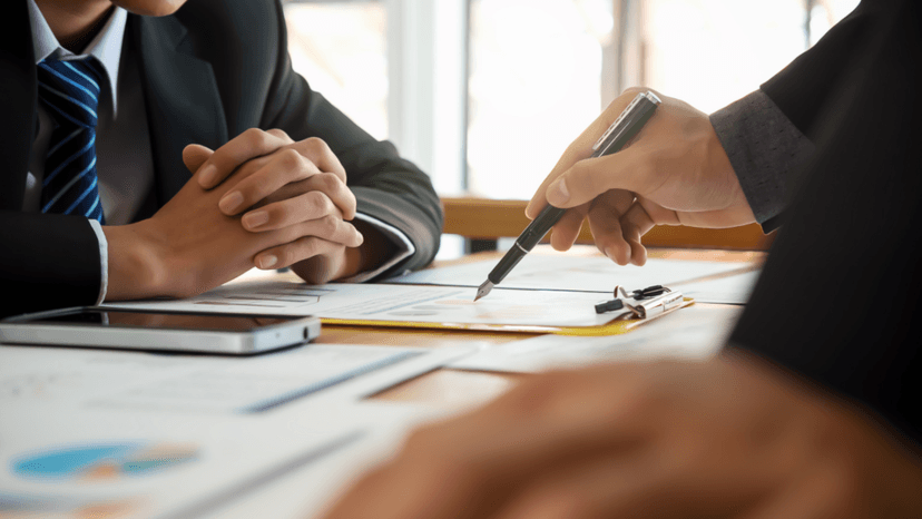 Tax adviser reviewing property tax documents with client 