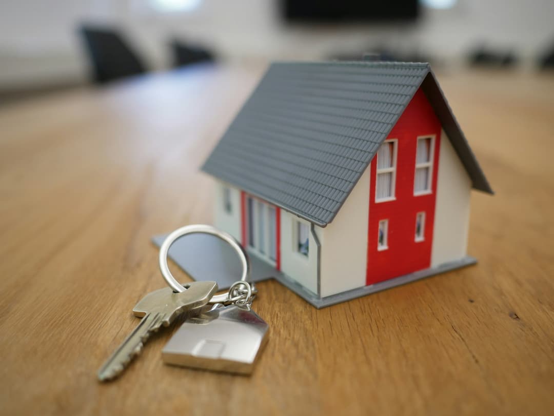 Small toy house with key next to it