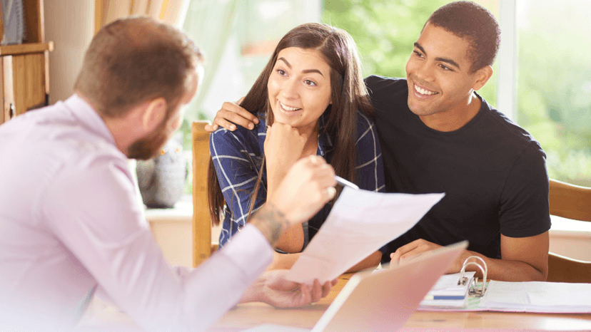 Couple reviewing property tax rate details with an advisor