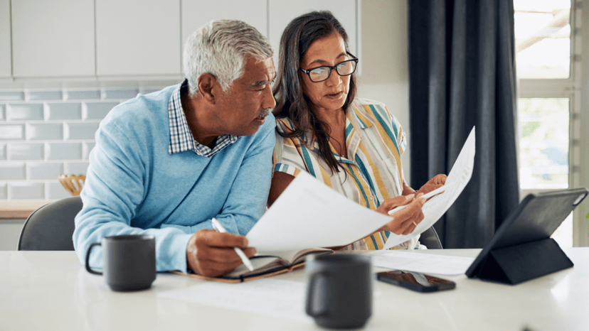 Couple reviewing their property tax assessment notice at home