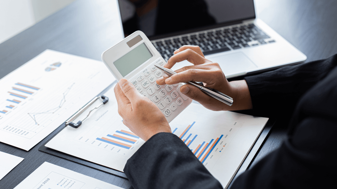 Reviewing property tax assessment data with charts and a calculator