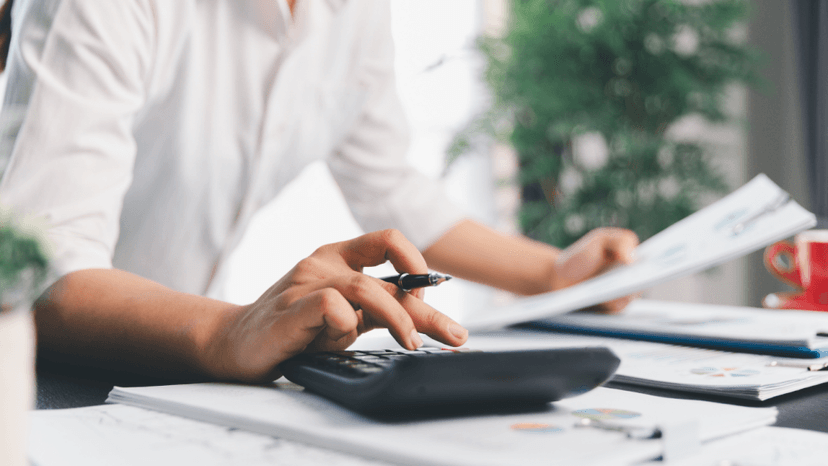 Tax adviser checking client’s tax documents to reduce overpayment