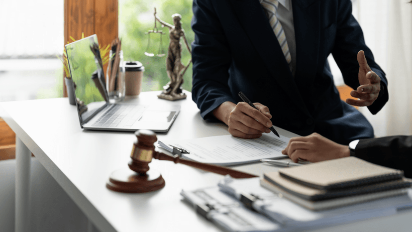A consultant walking a client through legal fees from delinquent property taxes