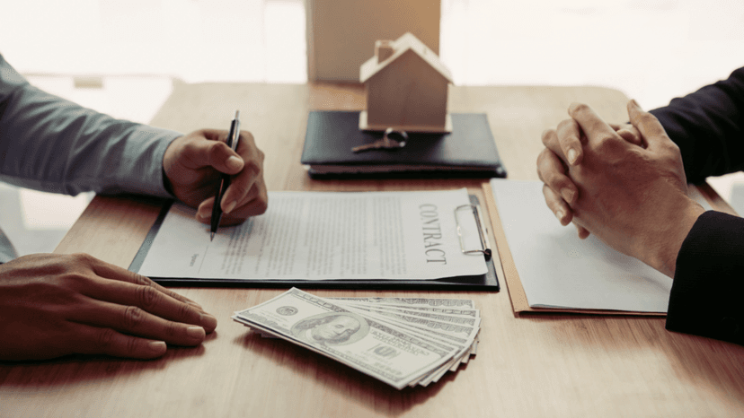 Buyer and agent reviewing home purchase contract and ownership cost details