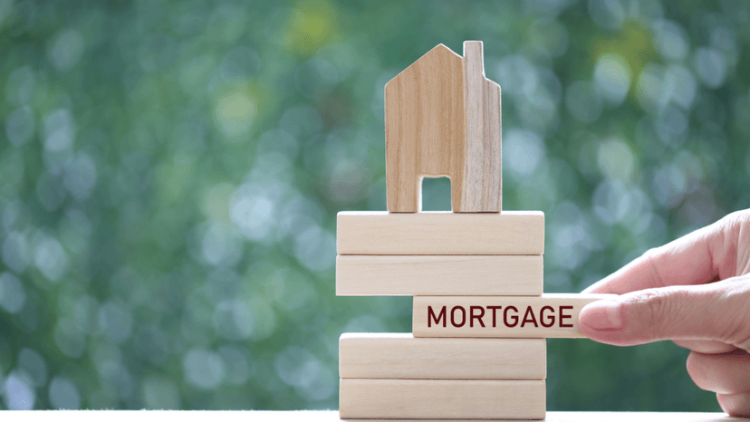Wooden blocks illustrating how mortgage payments support a home