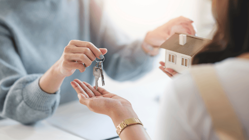 Buyer receiving house keys after closing on a Houston home