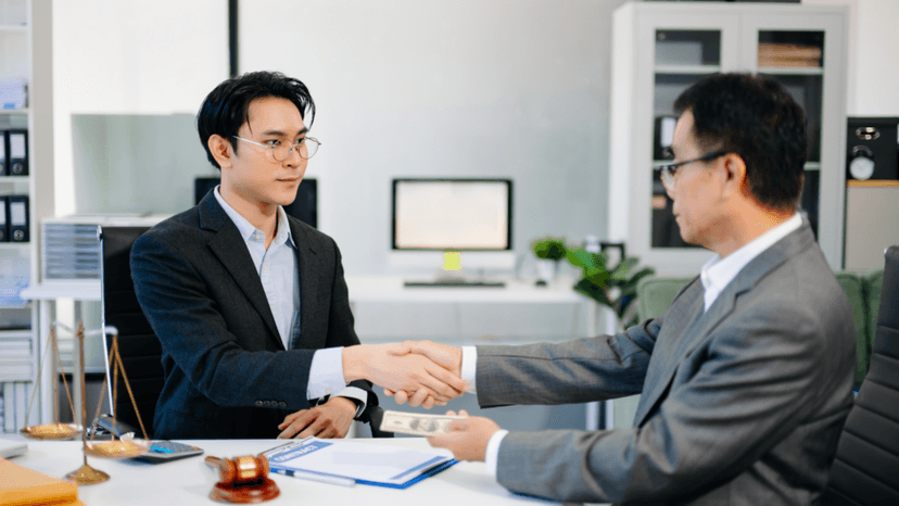 Consultant and client finalizing a commercial property tax appeal agreement