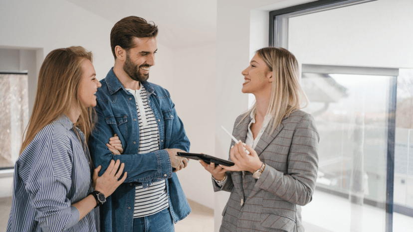 Real estate agent discussing homestead exemption with new homeowners