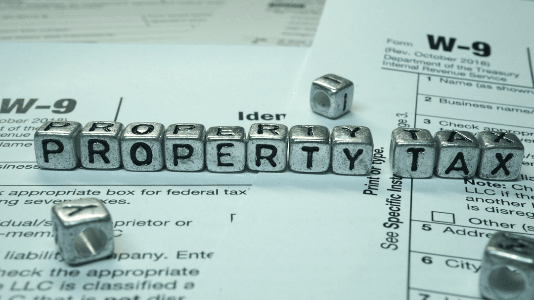Property tax concept represented with letter tiles and tax forms